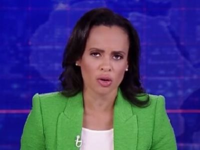 Linsey Davis can be seen on a green suit and white top in the picture.